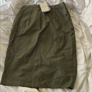 Faux leather green skirt .